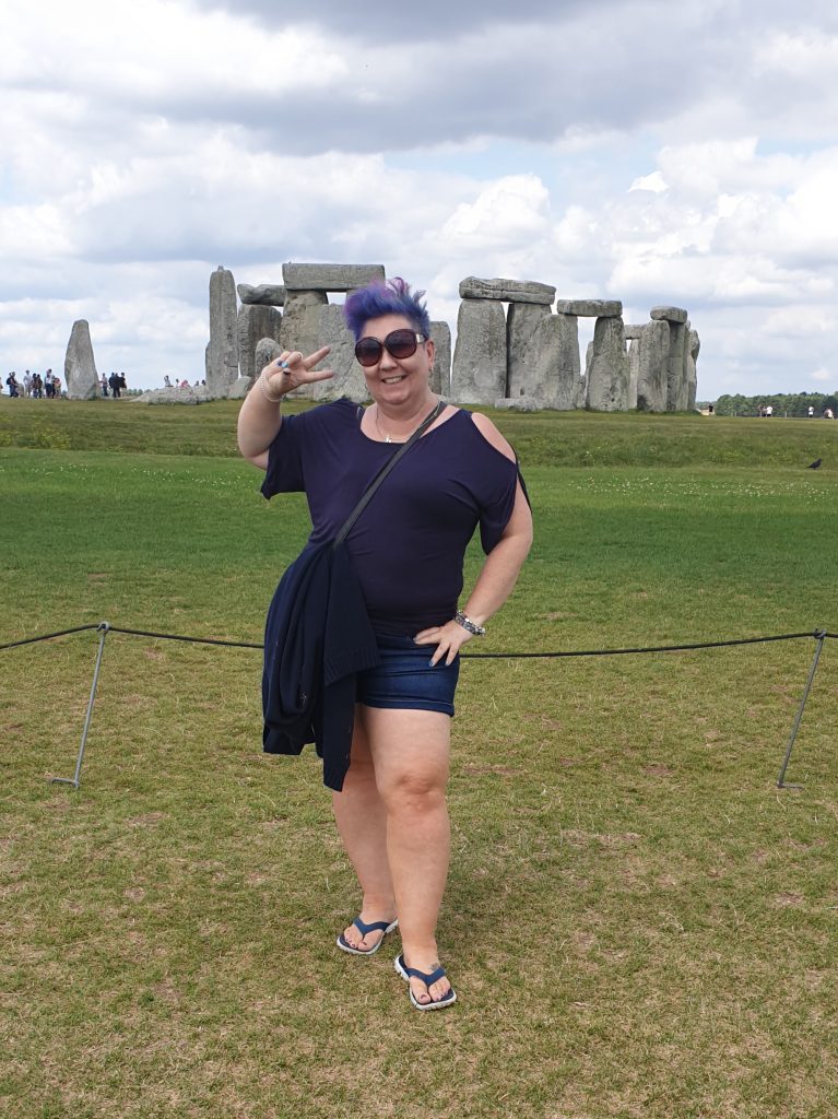 Tonya at Stonehenge 2019 doing a silly pose